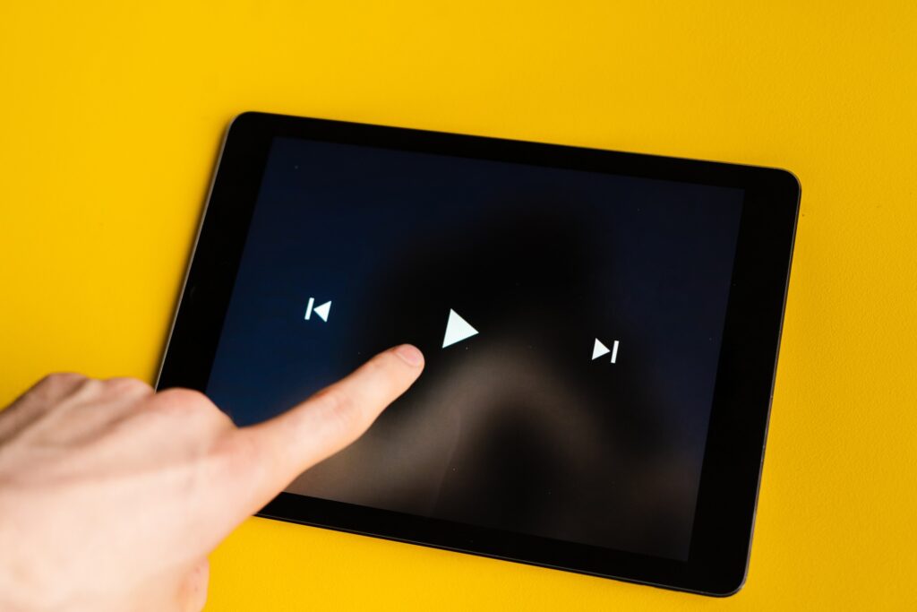 close up play button interface on a modern gadget when watching videos