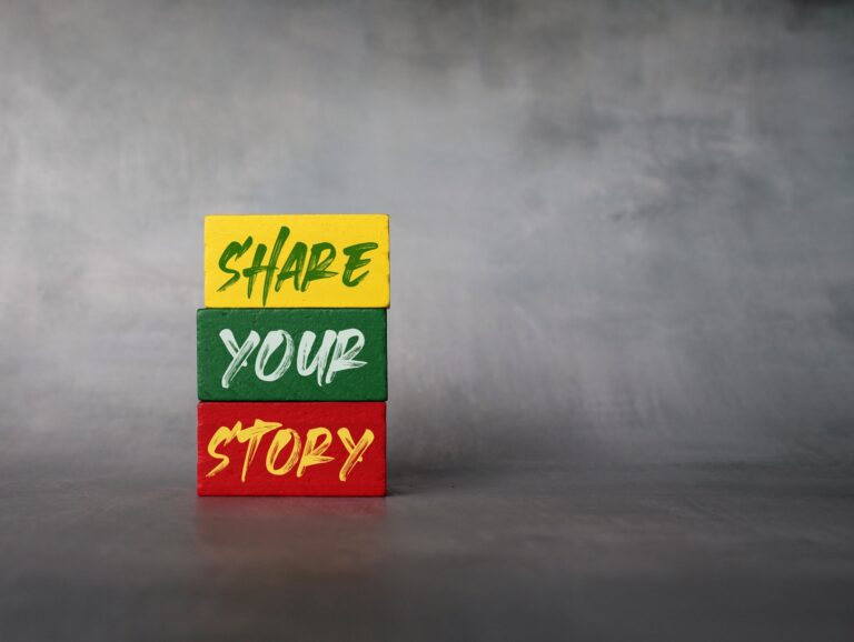 Wooden cubes with text SHARE YOUR STORY.